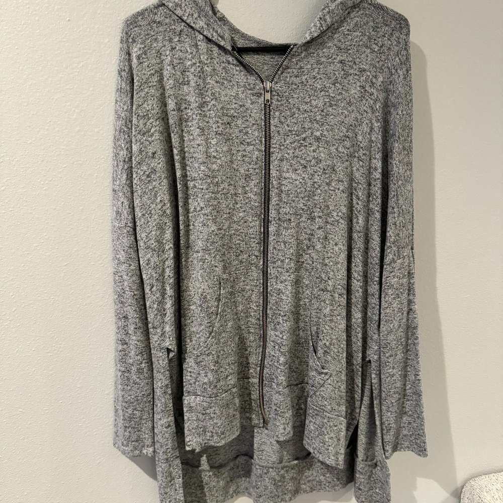 Grey zip up sweater with cutouts on side